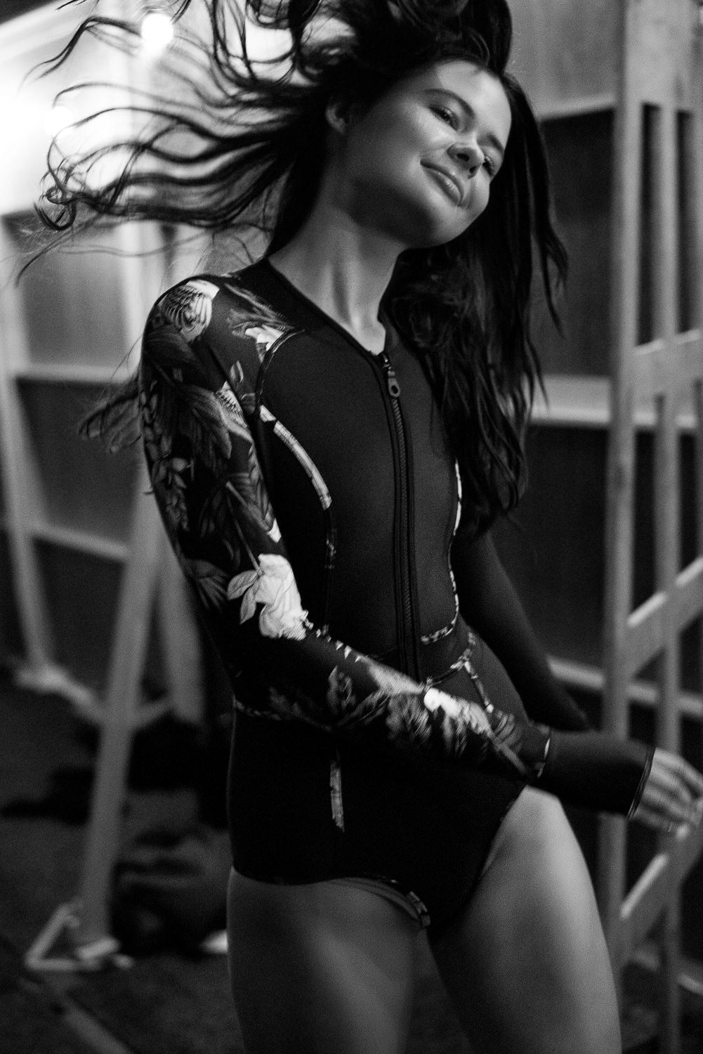 Backstage bounce, Eliza Baker (Chadwick Models), on a post walk high for Duskii Active in group Swim, runway.