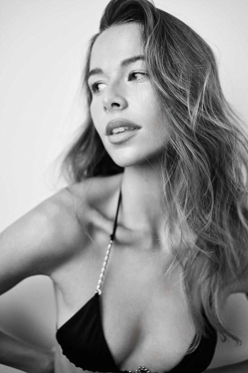Close black-and-white portrait of Jess Holiday looking to the side